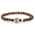 Smokey quartz gemstone beaded bracelet with a sterling silver Caviar skull.