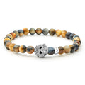 Tiger eye gemstone beaded bracelet with a sterling silver Caviar skull.