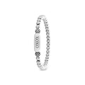 Signature Caviar XOXO Stretch Bead Bracelet featuring polished silver spheres and a rectangular charm inscribed with XOXO, designed for elegant everyday wear.