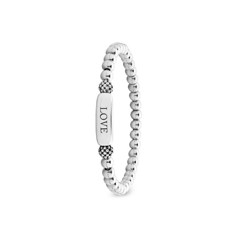 Signature Caviar Love Stretch Bead Bracelet with polished silver beads and an engraved LOVE bar-charm, showcasing timeless elegance and LAGOS craftsmanship.