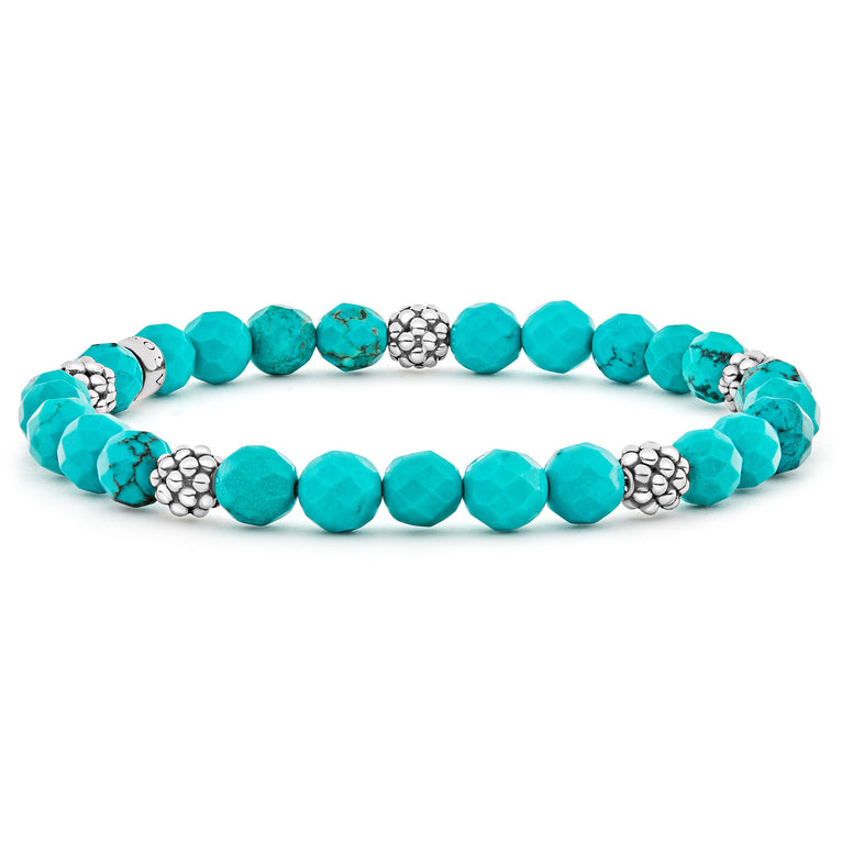 A turquoise gemstone bracelet with five sterling silver Caviar beaded stations.