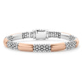 Six smooth stations of 18K rose gold surrounded by sterling silver Caviar beading form this bracelet.