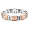 Seven smooth stations of 18K rose gold surrounded by sterling silver Caviar beading form this bracelet.