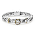 A white topaz gemstone and sterling silver Caviar beading with 18k gold detailing forms this bracelet.