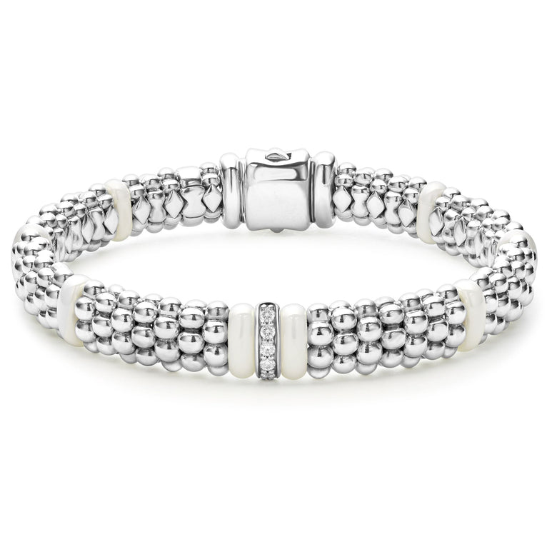 A LAGOS exclusive. A single diamond station set in sterling silver surrounded by white ceramic and Caviar beading. LAGOS diamonds are the highest quality natural stones.