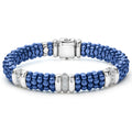 Three diamond and sterling silver stations set in an ultramarine ceramic beaded bracelet.
