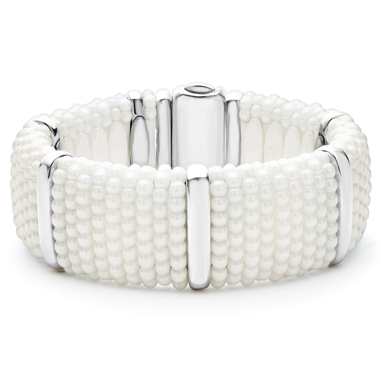 A white ceramic Caviar bracelet detailed with five smooth sterling silver stations and finished with a double-button box clasp with the LAGOS crest in 18K gold.