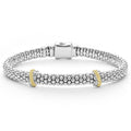 Sterling silver Caviar beading accented by two 18k gold and diamond stations form this detailed LAGOS bracelet. LAGOS diamonds are the highest quality natural stones.
