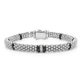A single diamond station set in sterling silver surrounded by black ceramic and Caviar beading. LAGOS diamonds are the highest quality natural stones.