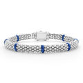 Seven smooth ultramarine ceramic stations highlight sterling silver Caviar beading on this signature bracelet.