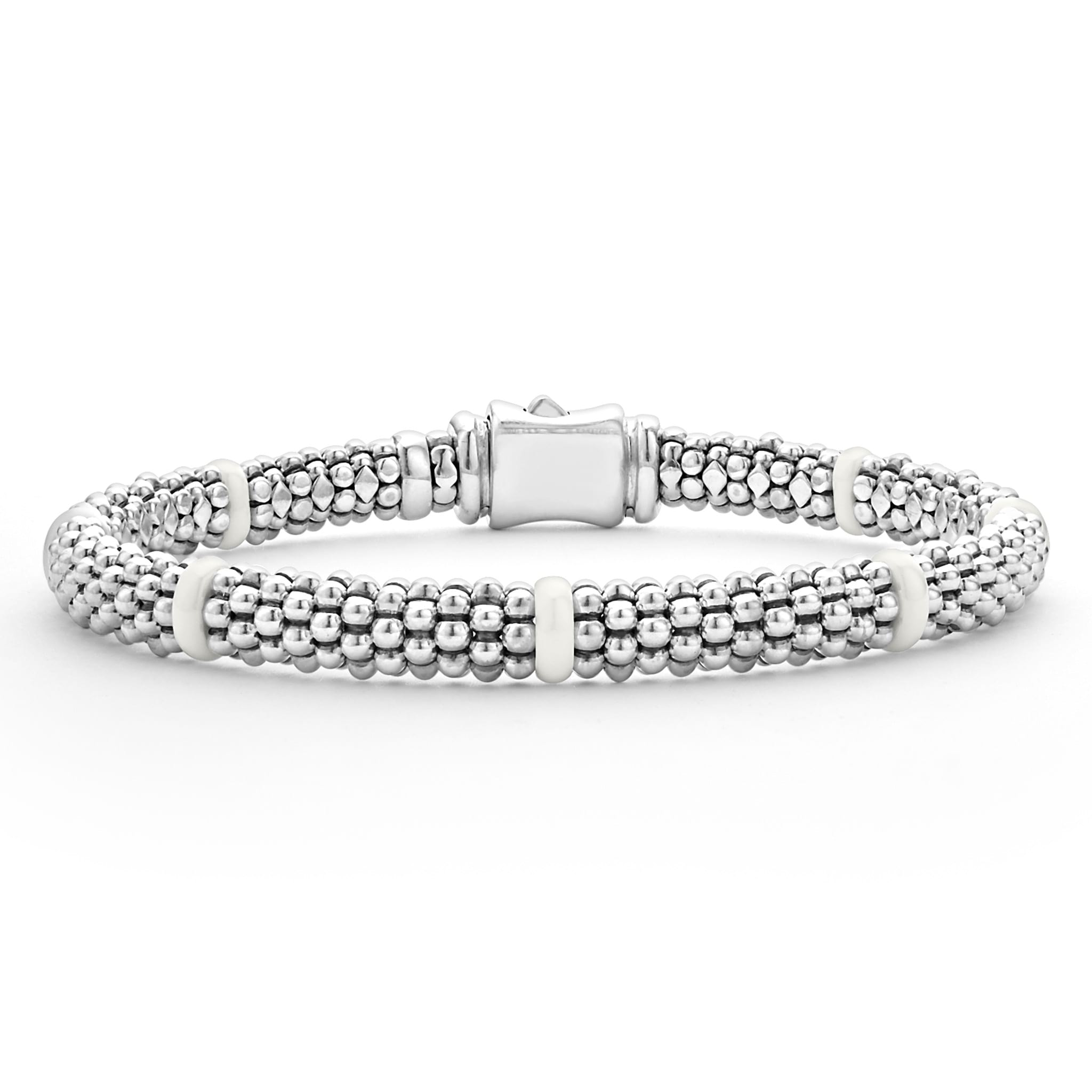 Seven smooth white ceramic stations highlight sterling silver Caviar beading on this signature bracelet.