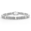 Seven smooth white ceramic stations highlight sterling silver Caviar beading on this signature bracelet.