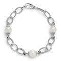 Three cultured freshwater pearl stations accent this sterling silver bracelet with Caviar beaded circle link accents.