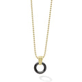 A black ceramic circle with an 18k gold Caviar beaded accent forms this pendant on a gold necklace.