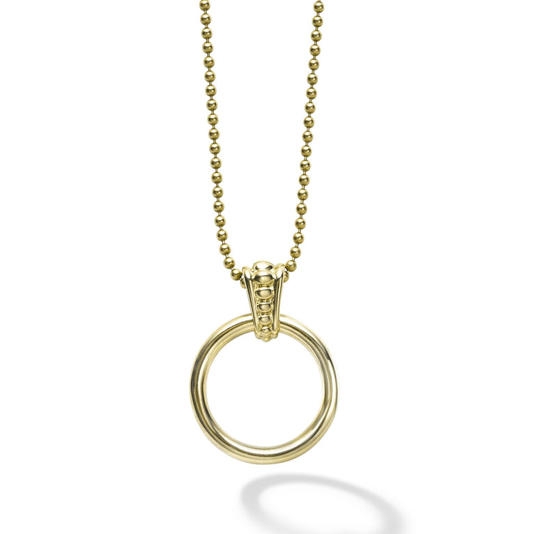 An 18k gold circle with a Caviar beaded accent forms this pendant on an 18k gold ball chain necklace.