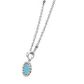 Maya Small Ceramic Circle Pendant Necklace with a turquoise-blue centerpiece and sterling silver Caviar beading on a delicate silver chain.