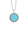 A blue ceramic pendant framed by sterling silver Caviar beading finsihed on a versatile ball chain necklace.
