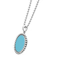 Maya Large Ceramic Circle Pendant Necklace features a turquoise ceramic oval framed by sterling silver Caviar beading, suspended on a silver bead chain.