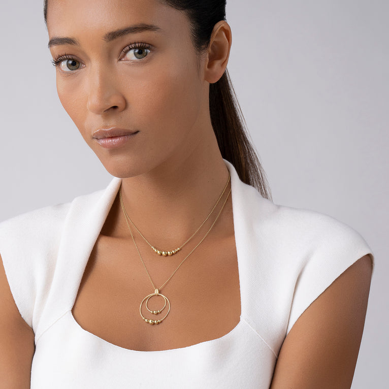 Graduated bead necklace deals