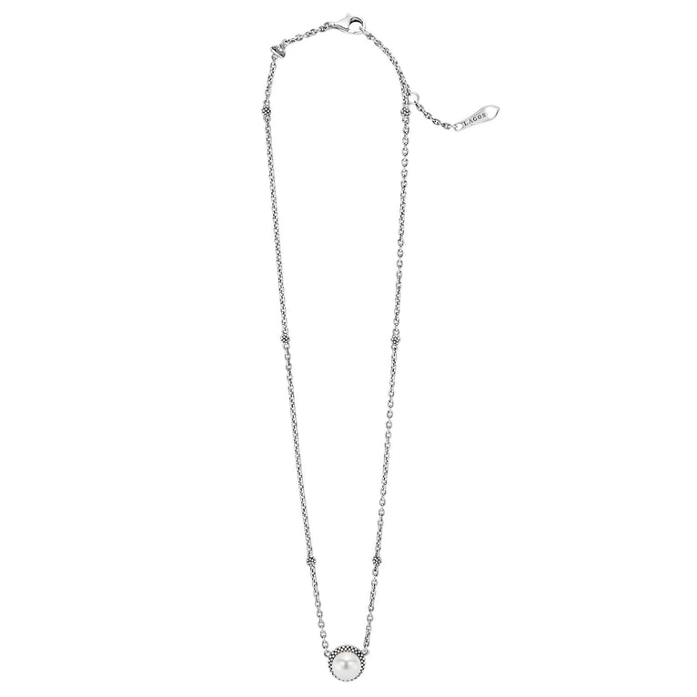 Luna Sterling Silver Pearl Earrings & Necklace Gift Set featuring a delicate silver chain with beaded accents and a central pearl in a textured caviar-style bezel.